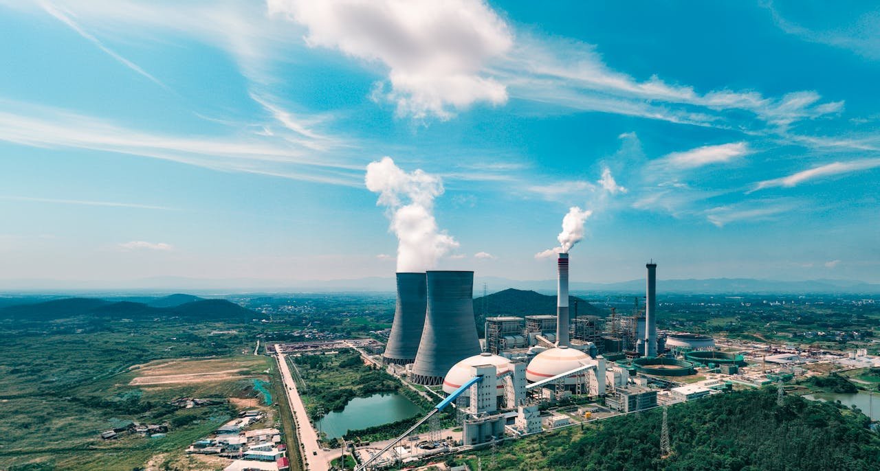 Aerial view of an industrial power plant near Jiujiang, showcasing infrastructure and landscape.